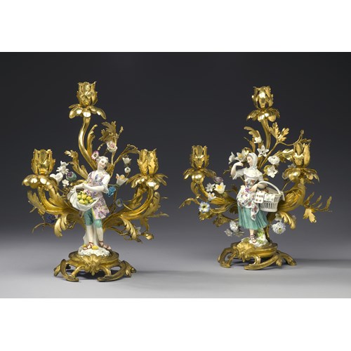 Two figures of the series of the "Cris de Paris"  mounted as three-branch candelabra